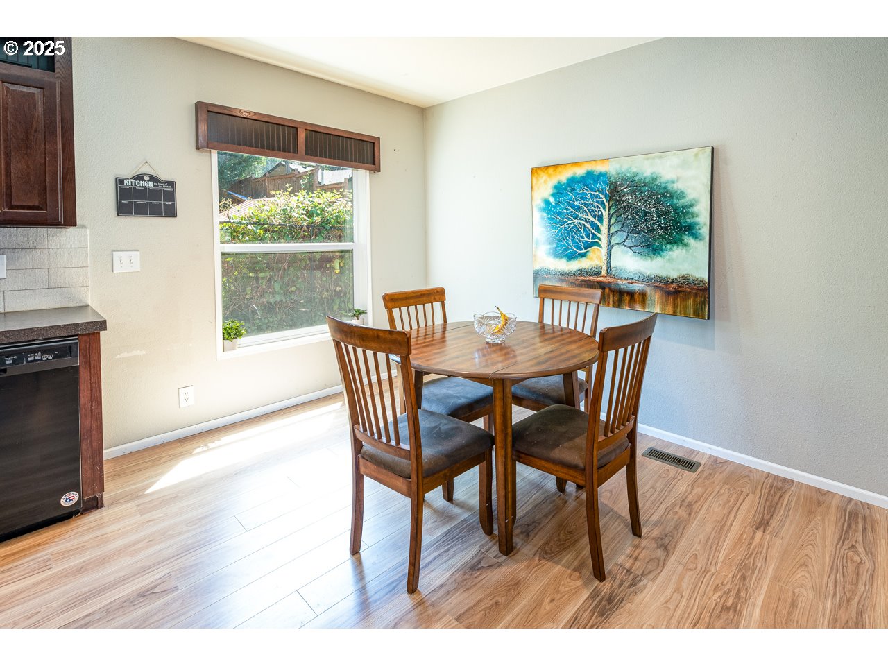466 South 71st Street Springfield, OR 97478 - Photo 15 of 33 a view of a dining room with furniture and wooden floor
