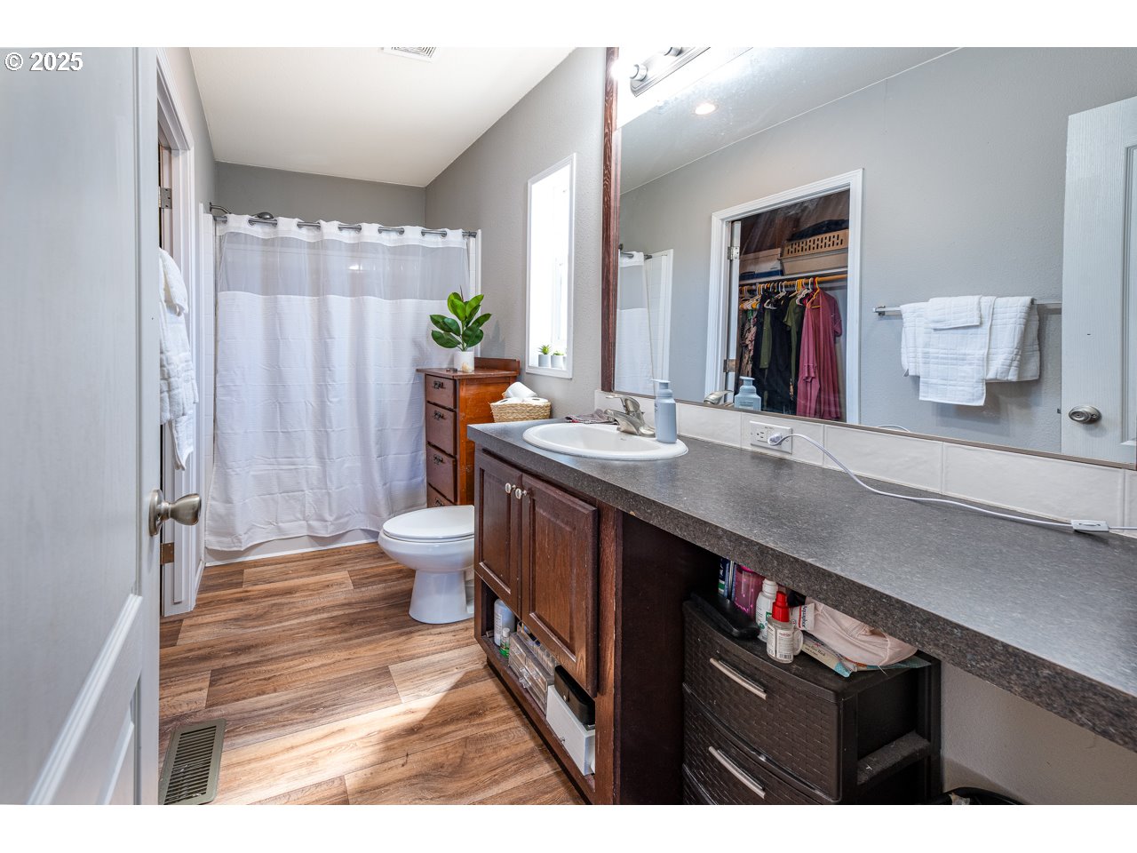 466 South 71st Street Springfield, OR 97478 - Photo 19 of 33 a bathroom with a sink a toilet and shower