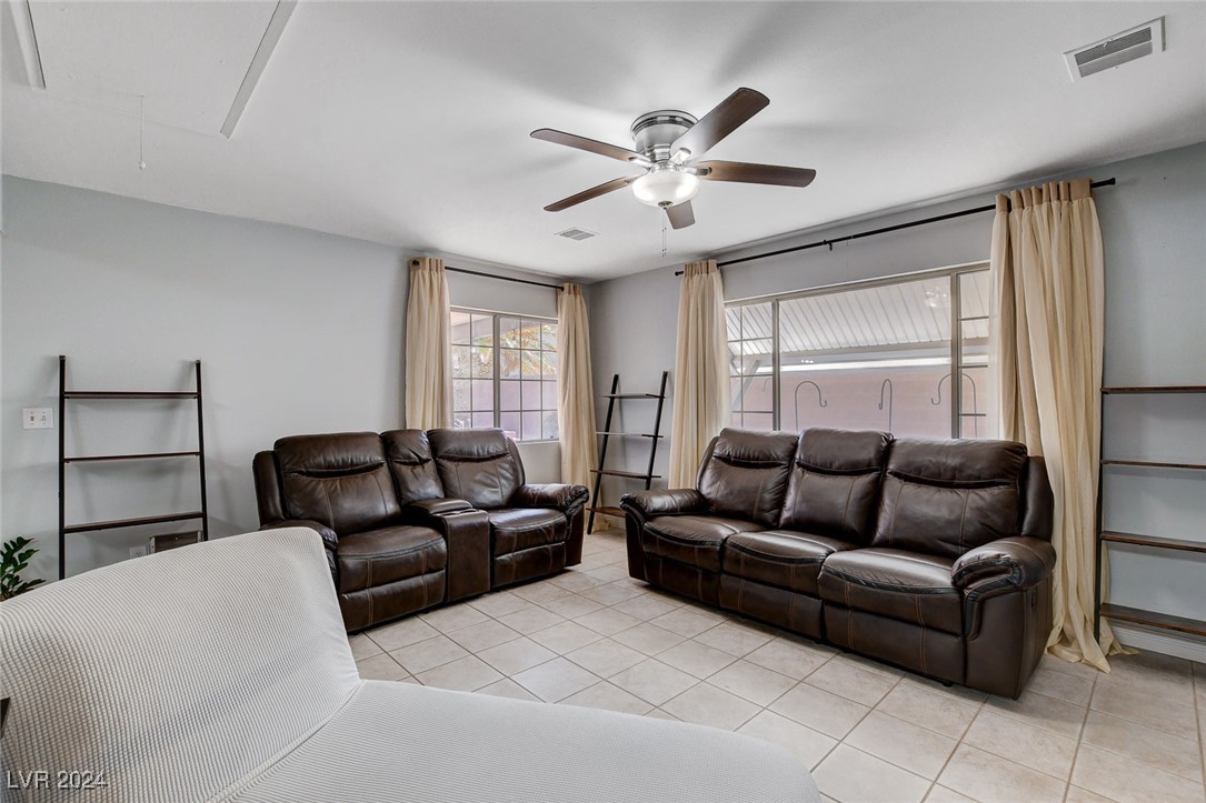 3153 Viewcrest Avenue Henderson, NV 89014 - Photo 20 of 49 Off the Kitchen and Dining Area is a large Family Room overlooking the rear yard with a continuation of easy-care tile flooring.