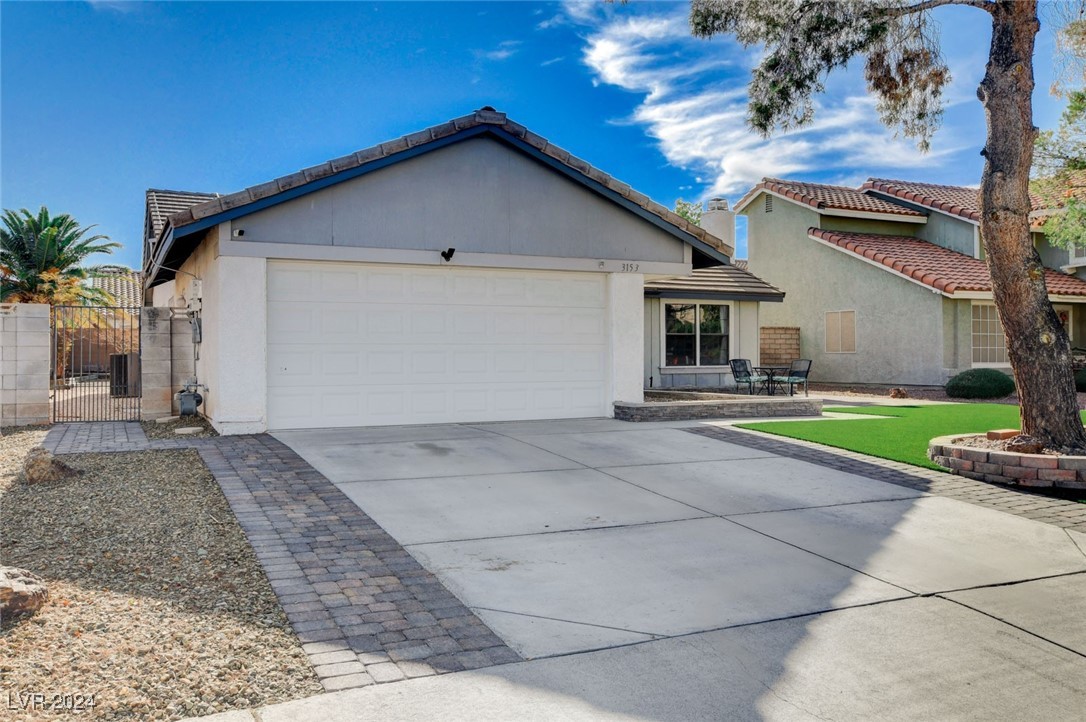 3153 Viewcrest Avenue Henderson, NV 89014 - Photo 2 of 49 Eye-catching curb appeal as you note the nicely manicured green turf lawn and adorable brick pavered patio.