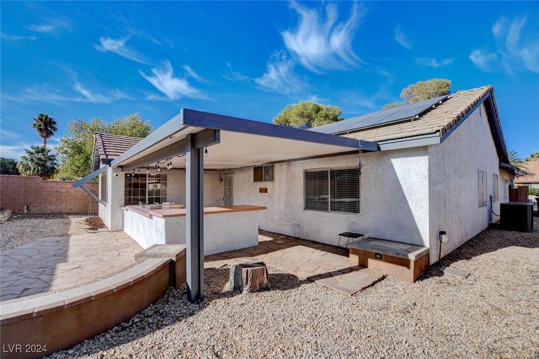 3153 Viewcrest Avenue Henderson, NV 89014 - Photo 46 of 49 Backyard features a large covered patio with flagstone flooring, built-in BBQ and a blank canvas backyard awaiting your creativity!