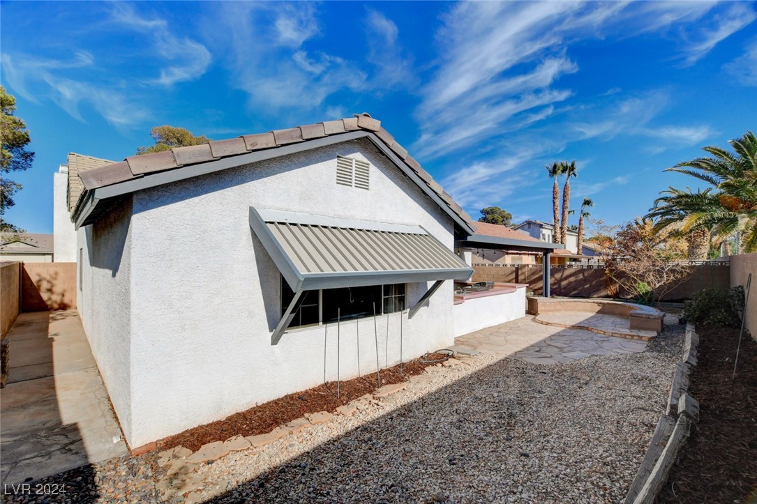 3153 Viewcrest Avenue Henderson, NV 89014 - Photo 48 of 49 Backyard features a large covered patio with flagstone flooring, built-in BBQ and a blank canvas backyard awaiting your creativity!