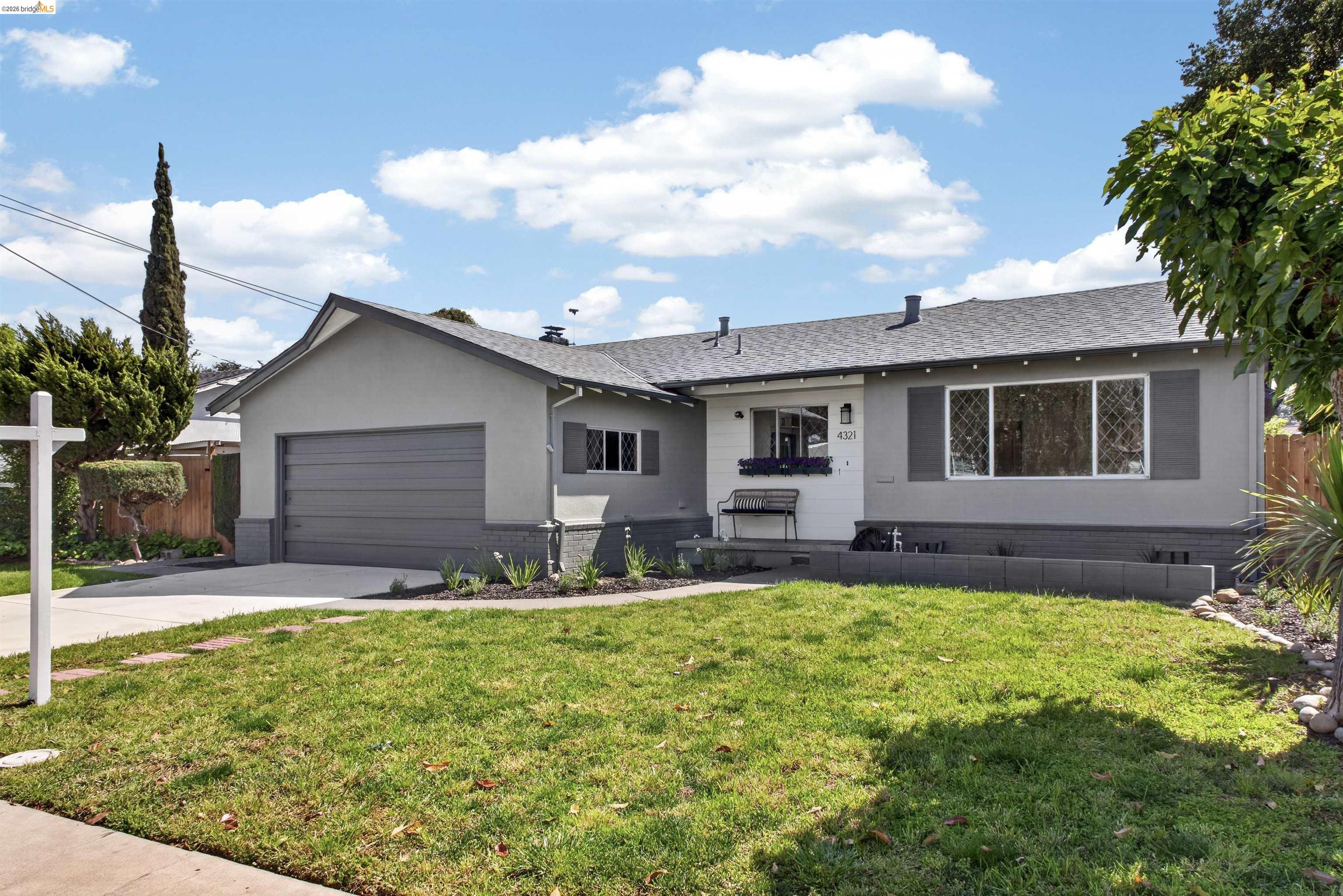 4321 Davis Way Livermore, CA 94550 - Photo 1 of 34 Single-story residence featuring a two-tone gray exterior, a paved driveway, and an attached single-car garage