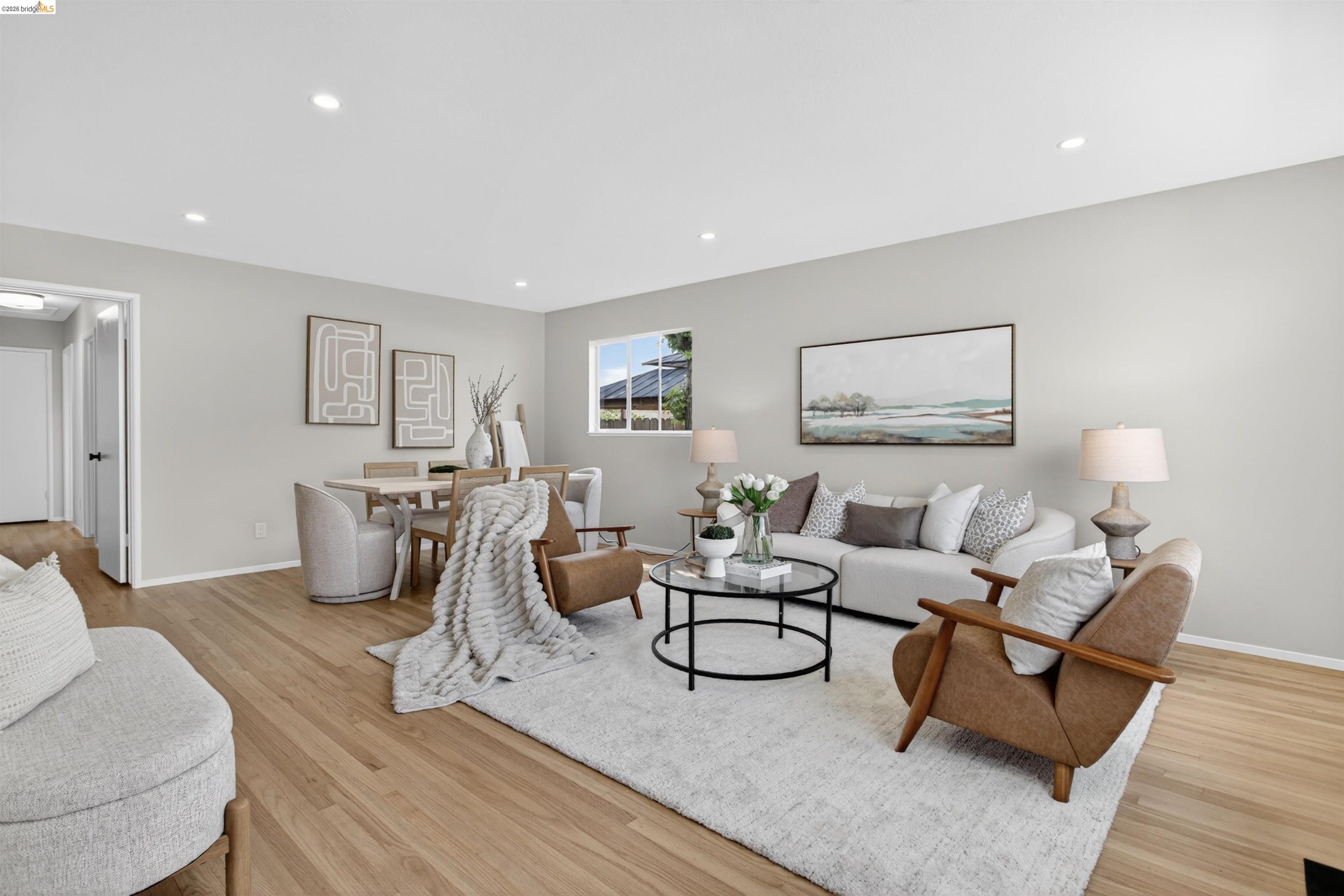 4321 Davis Way Livermore, CA 94550 - Photo 3 of 34 Open-concept living space featuring wood-finish flooring, recessed lighting, and light-toned walls