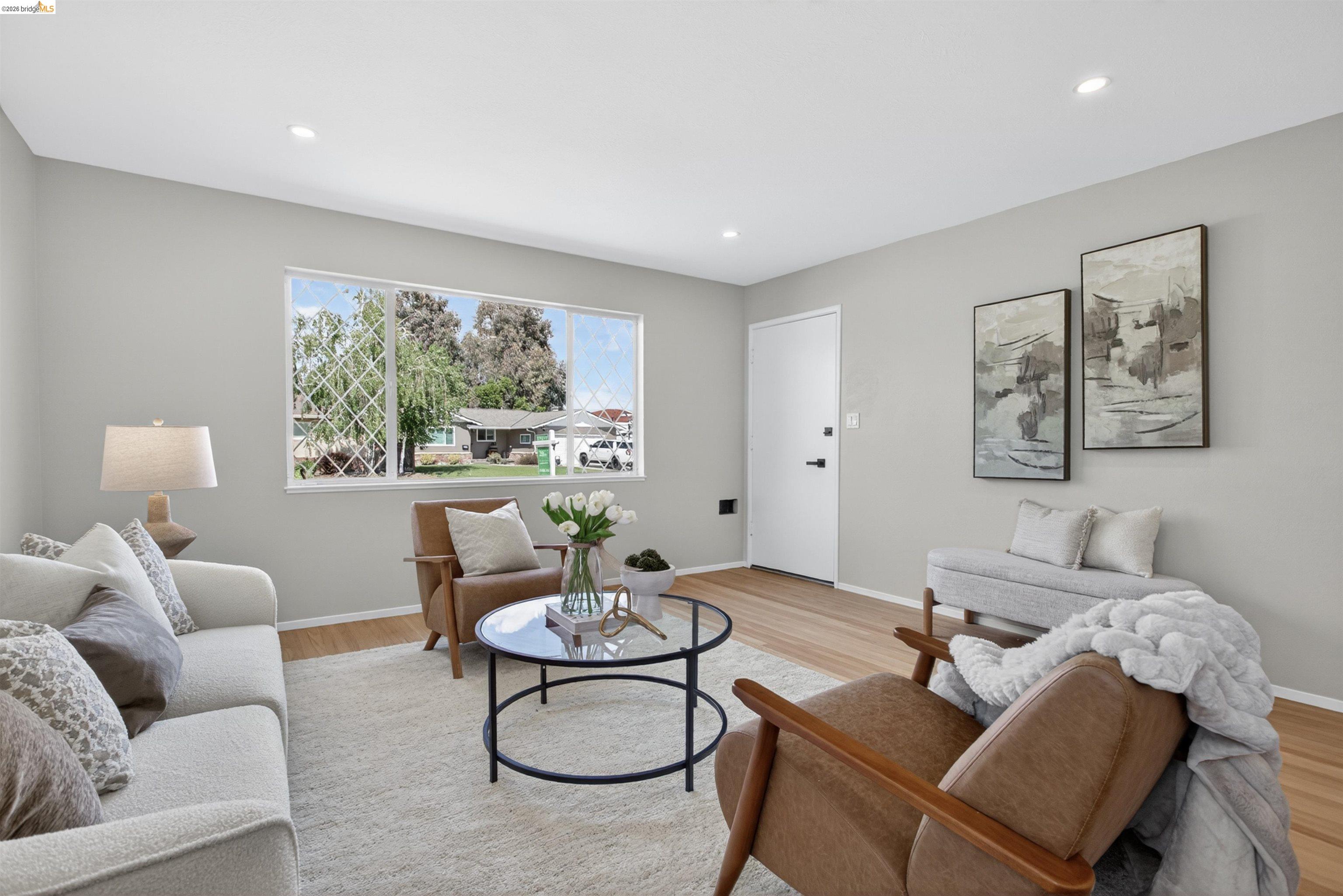 4321 Davis Way Livermore, CA 94550 - Photo 5 of 34 Living area featuring light wood-finish flooring, recessed lighting, and a large picture window