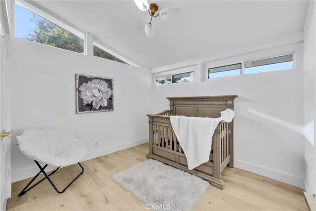a white livingroom with a dinning table and chair