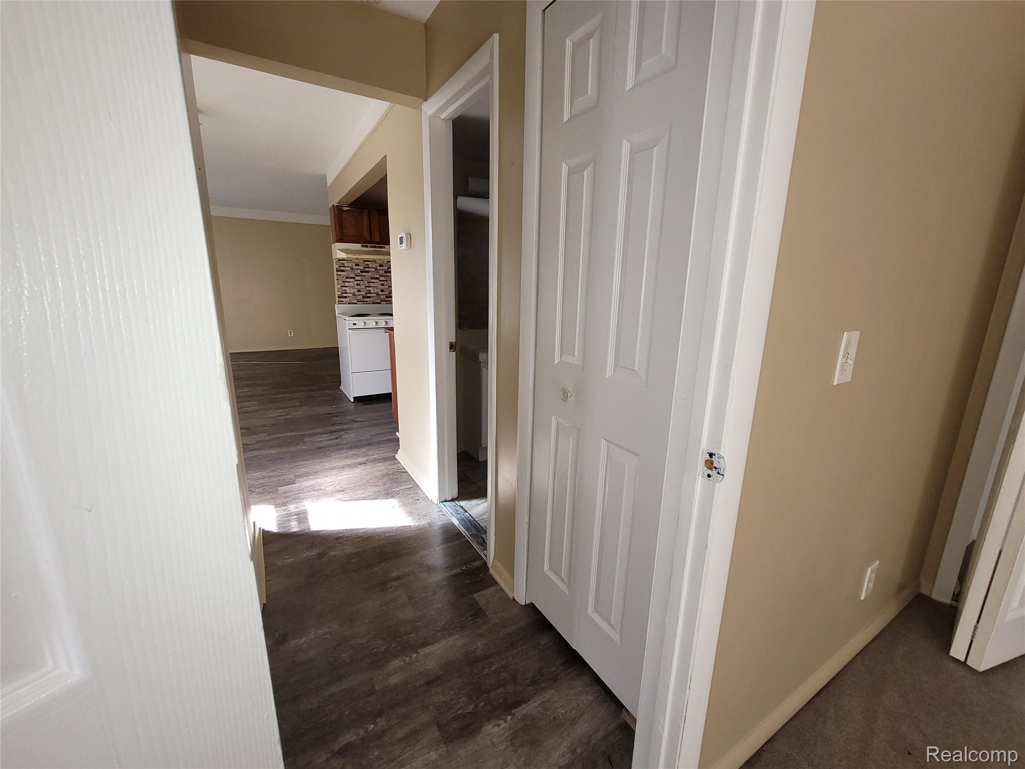 16470 East 9 Mile Road, Unit 104 Eastpointe, MI 48021 - Photo 11 of 14 Hall with dark wood-style floors
