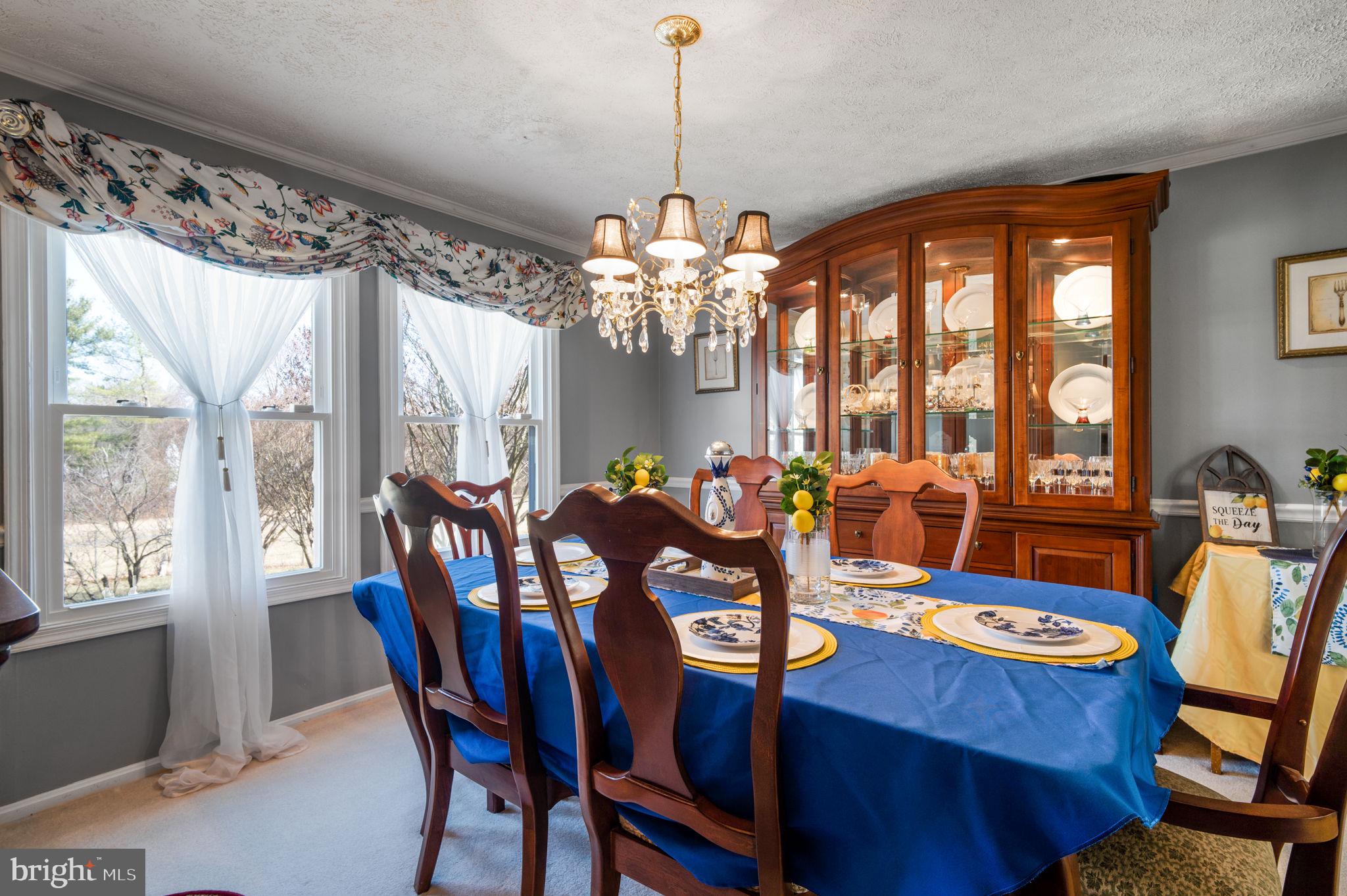 11006 Lake Arbor Way Bowie, MD 20721 - Photo 11 of 46 a view of a dining room with furniture wooden floor and chandelier