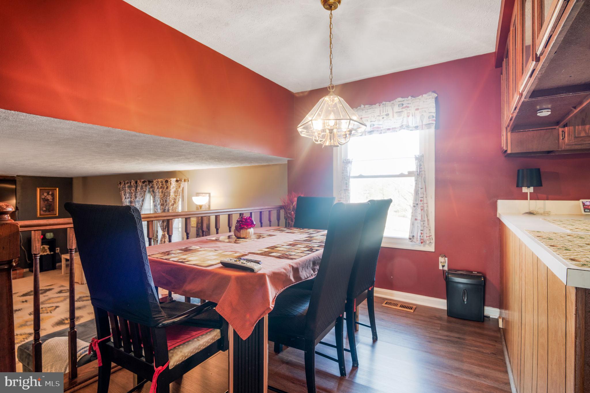 11006 Lake Arbor Way Bowie, MD 20721 - Photo 15 of 46 a view of a dining room with furniture window and wooden floor