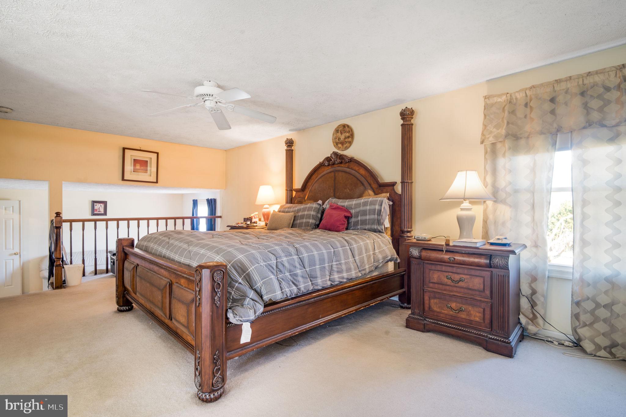 11006 Lake Arbor Way Bowie, MD 20721 - Photo 21 of 46 a bedroom with a bed dresser and a window