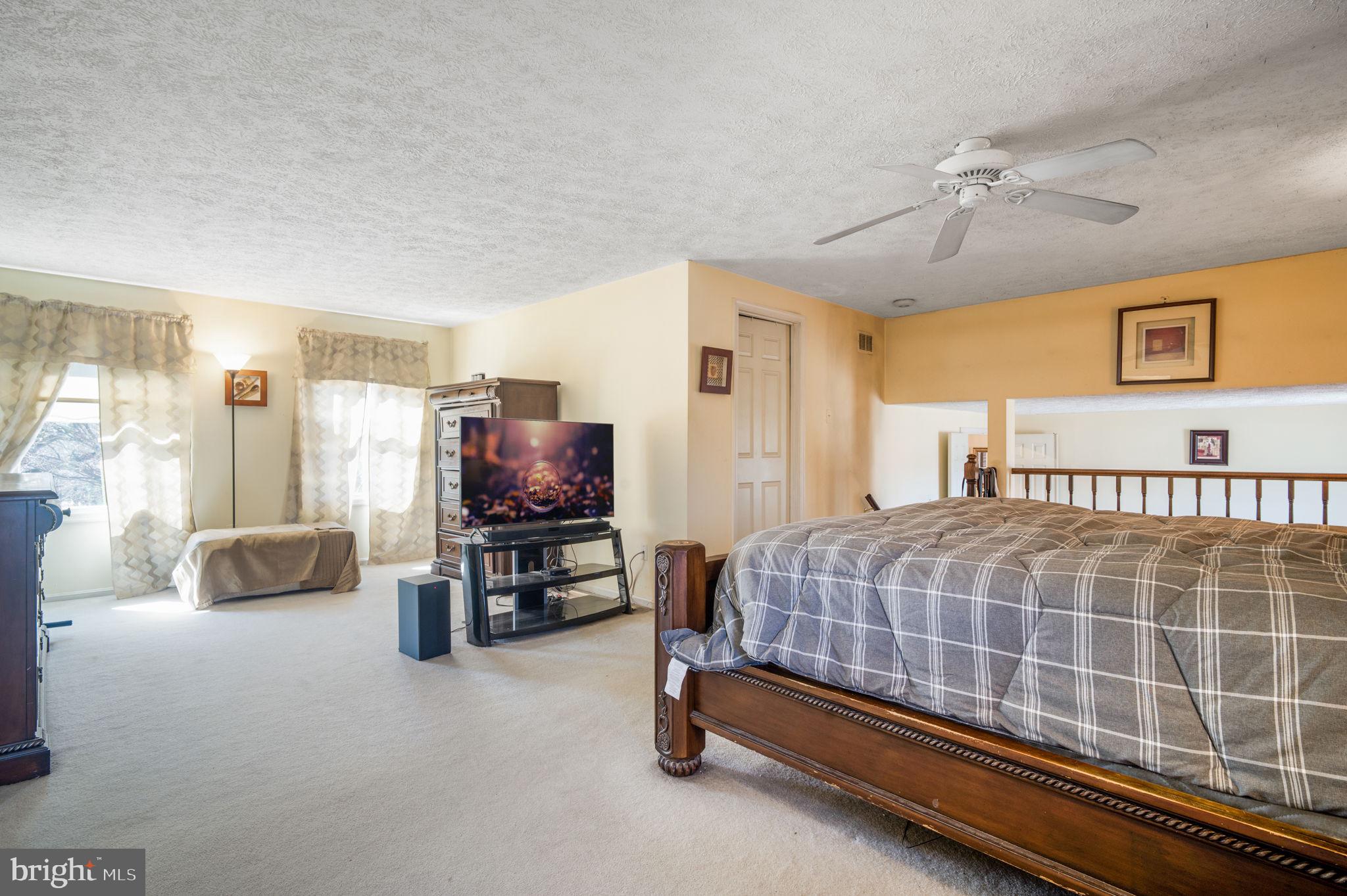 11006 Lake Arbor Way Bowie, MD 20721 - Photo 22 of 46 a bedroom with a bed and balcony view