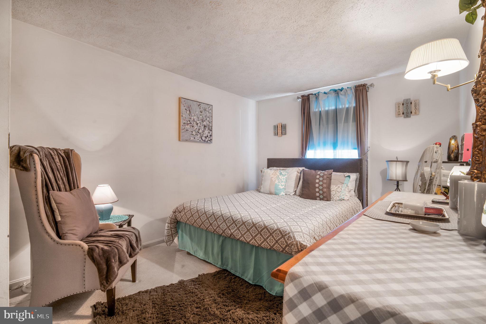 11006 Lake Arbor Way Bowie, MD 20721 - Photo 28 of 46 a bedroom with a bed and wooden floor