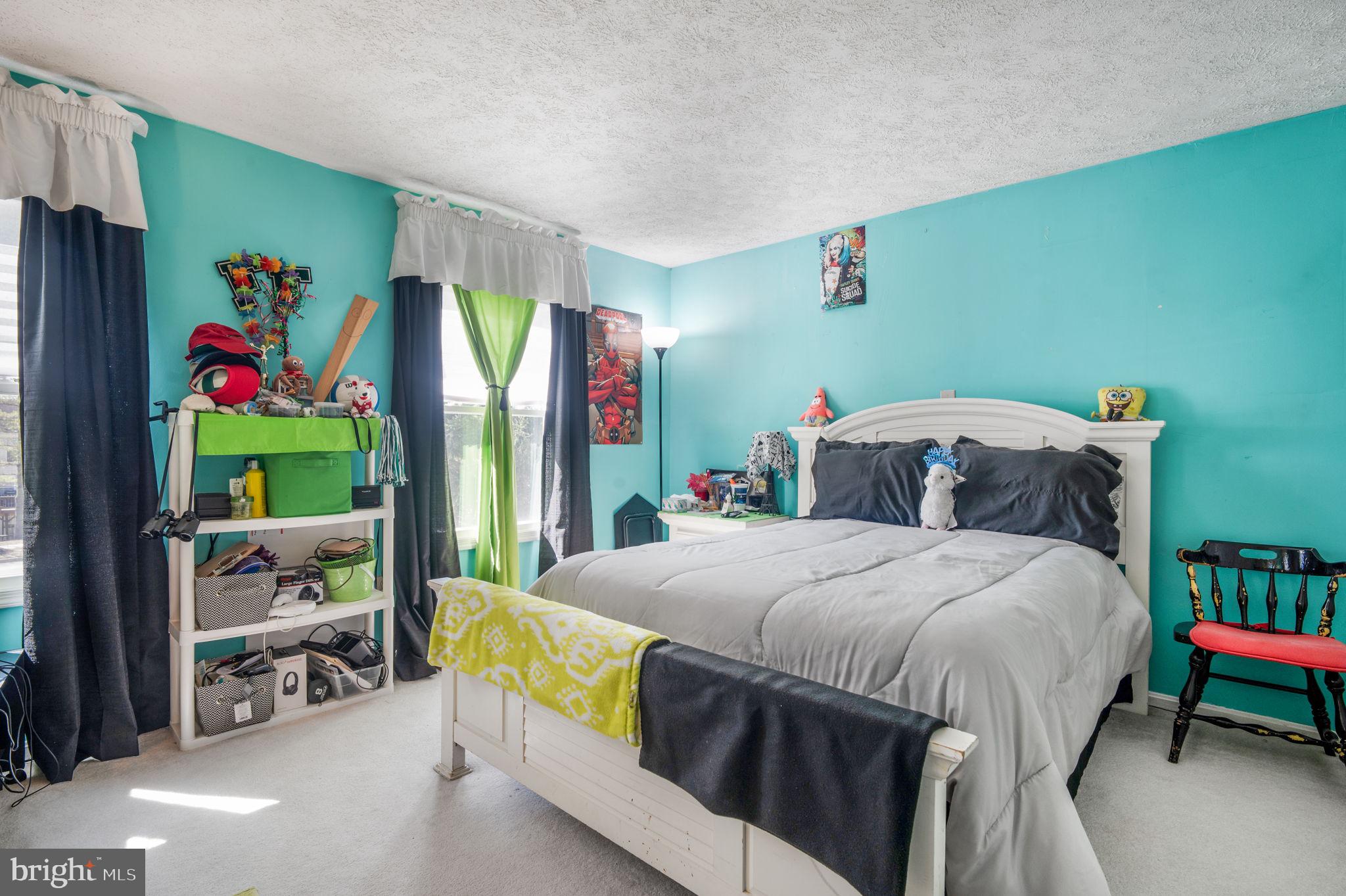 11006 Lake Arbor Way Bowie, MD 20721 - Photo 29 of 46 a bedroom with a bed table and a window