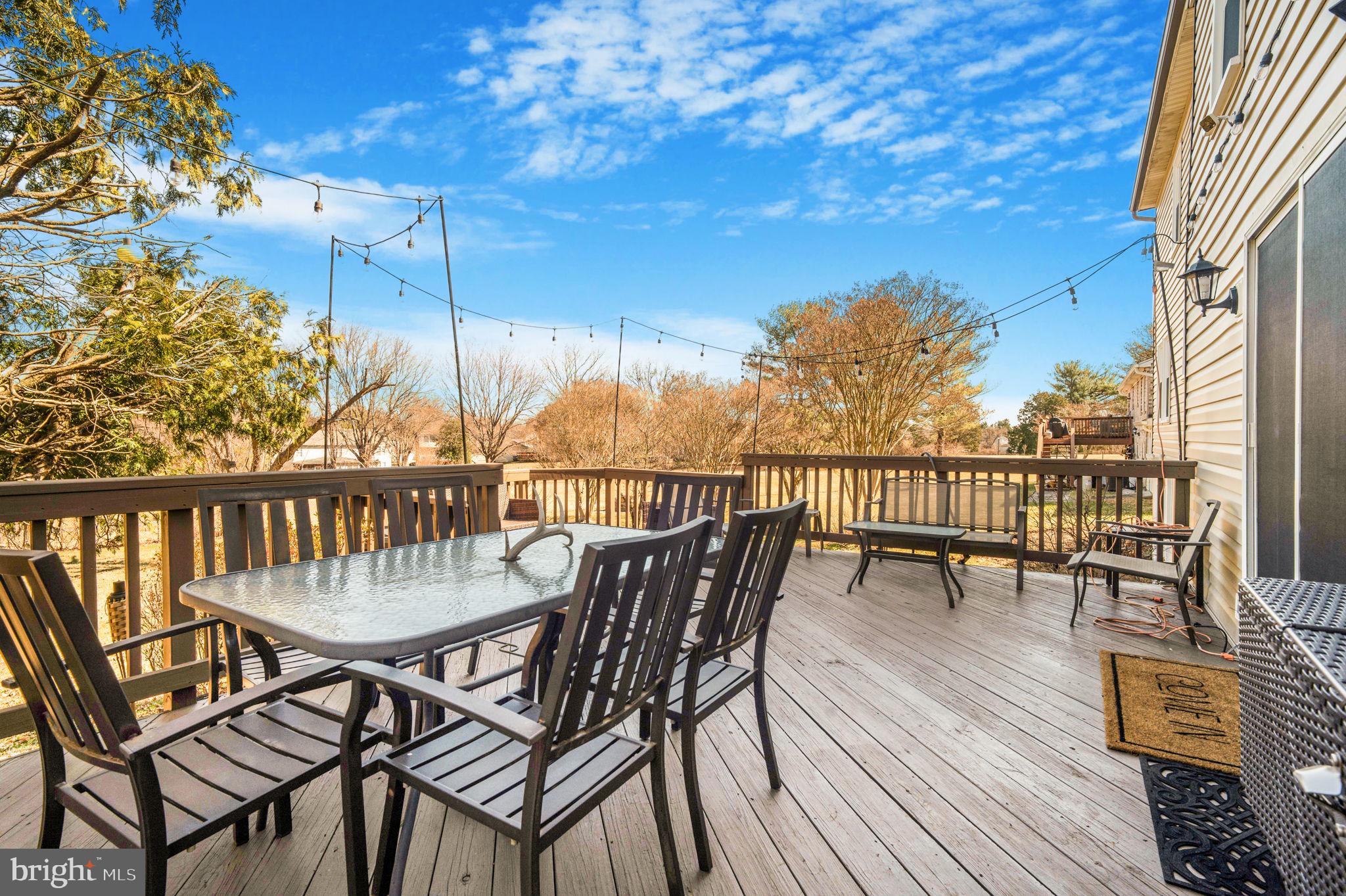 11006 Lake Arbor Way Bowie, MD 20721 - Photo 36 of 46 a view of a balcony with wooden floor and outdoor seating