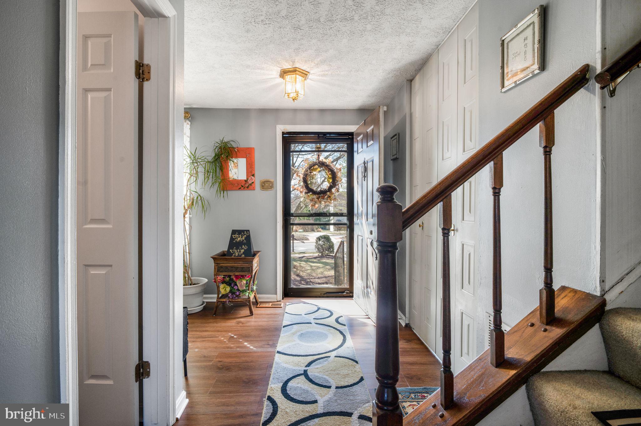 11006 Lake Arbor Way Bowie, MD 20721 - Photo 4 of 46 a hallway with wooden floor and furniture