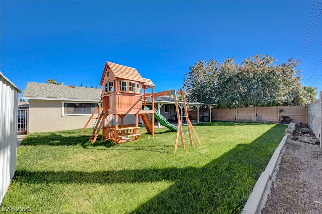 1331 Pinto Road Boulder City, NV 89005 - Photo 40 of 46 A spacious, grassy backyard provides an ideal setting for play and relaxation.
