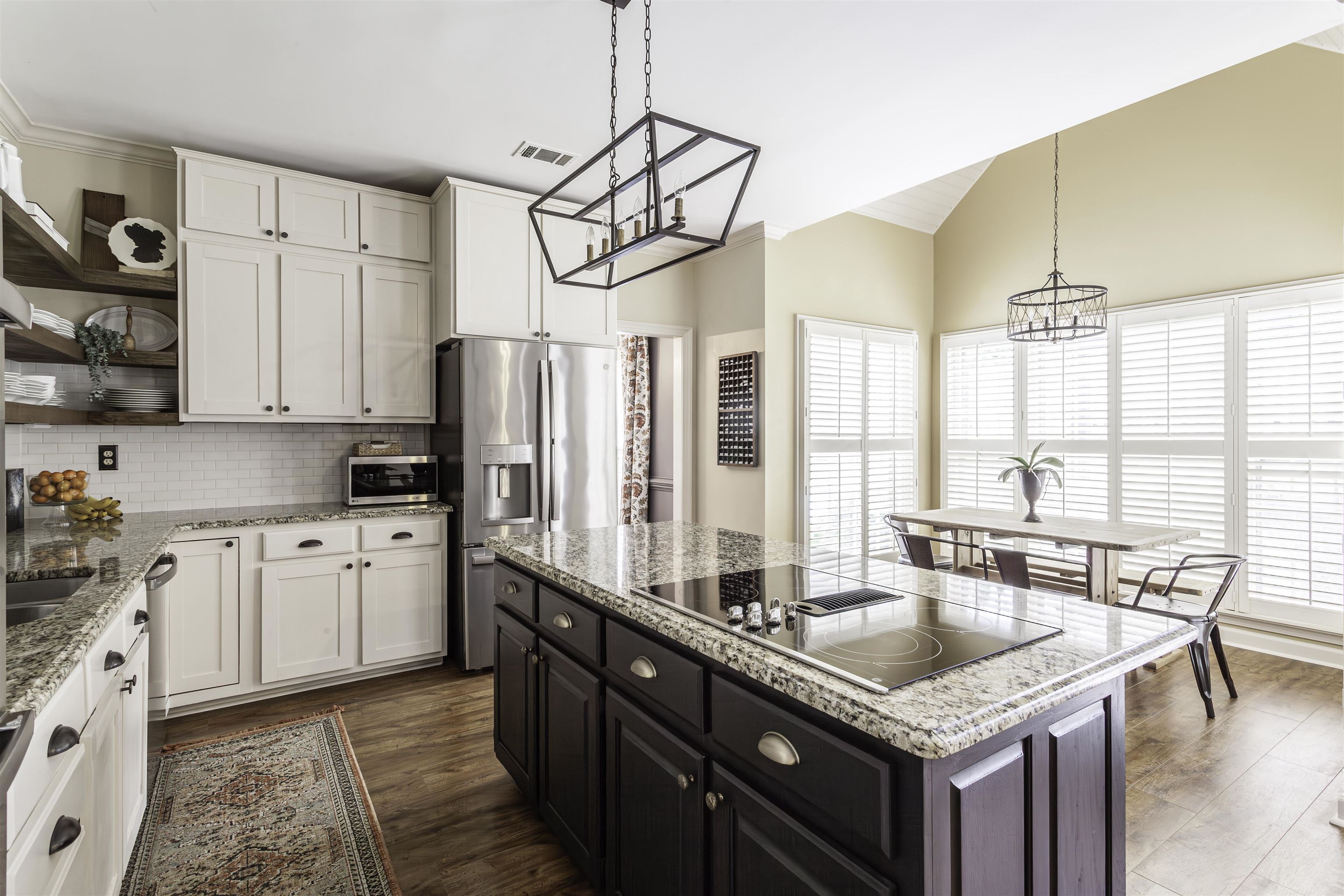 263 Hound Ridge Cove Collierville, TN 38017 - Photo 8 of 25 a kitchen with stainless steel appliances granite countertop a sink a stove and refrigerator
