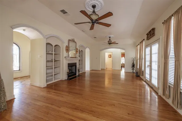 a view of a room with wooden floor