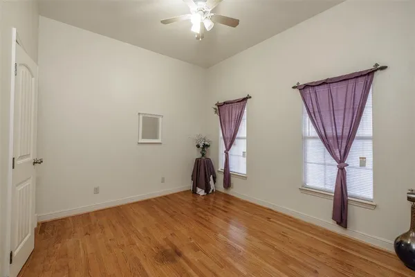 a bathroom with a double vanity sink mirror and toilet