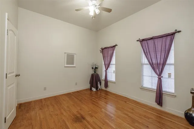 a bathroom with a double vanity sink mirror and toilet