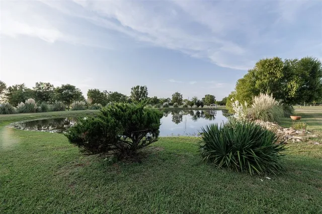 a view of a lake with a big yard