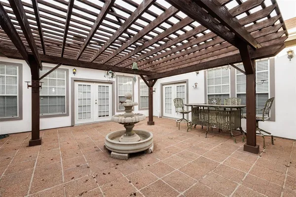 a table and chairs with wooden fence