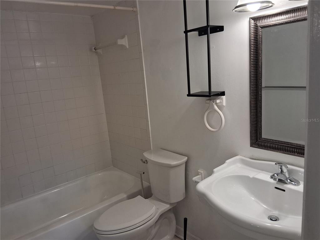 958 Lake Destiny Road, Unit D Altamonte Springs, FL 32714 - Photo 11 of 16 a bathroom with a toilet sink and shower