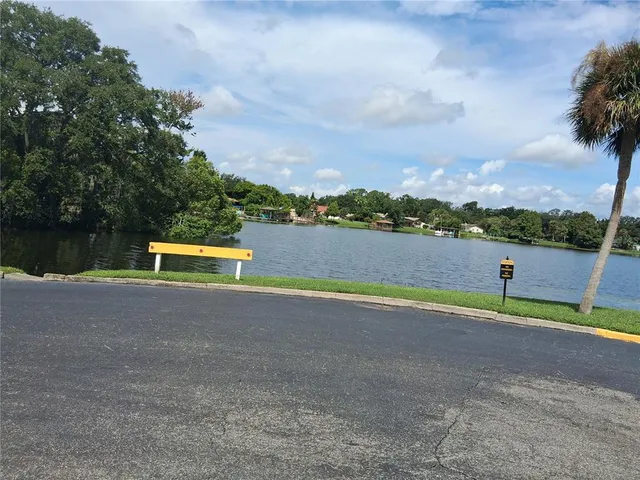 an outdoor view with swimming pool and seating space