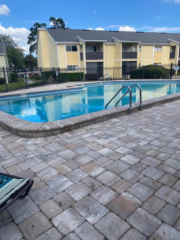 958 Lake Destiny Road, Unit D Altamonte Springs, FL 32714 - Photo 15 of 16 an outdoor view with swimming pool and seating space