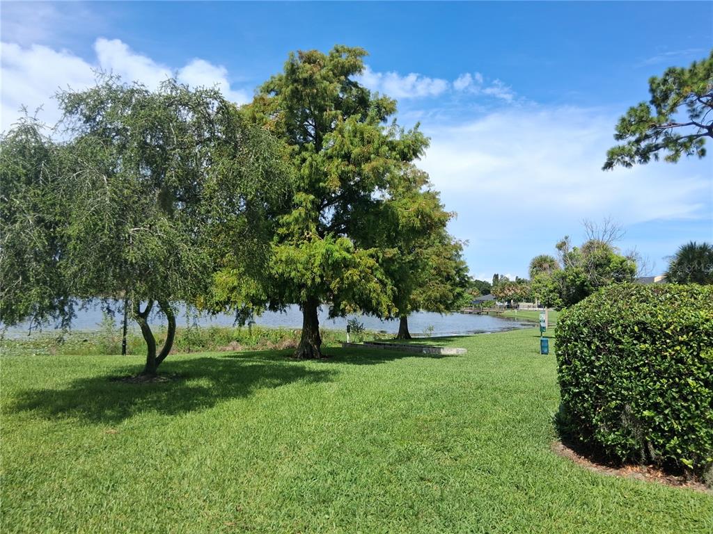 958 Lake Destiny Road, Unit D Altamonte Springs, FL 32714 - Photo 16 of 16 a view of grassy field with benches