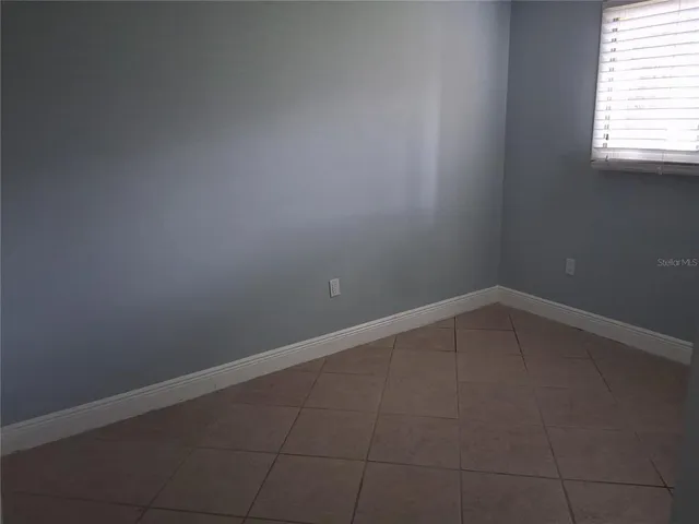 a bathroom with a toilet sink and shower