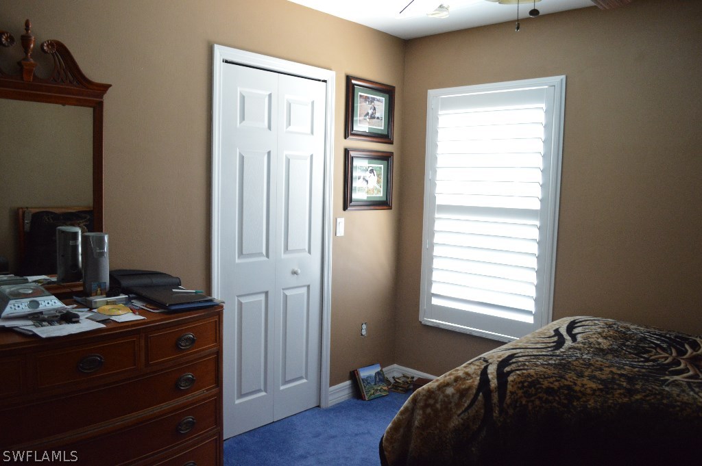 21951 Claytor Road Alva, FL 33920 - Photo 12 of 17 a bedroom with a bed and a window