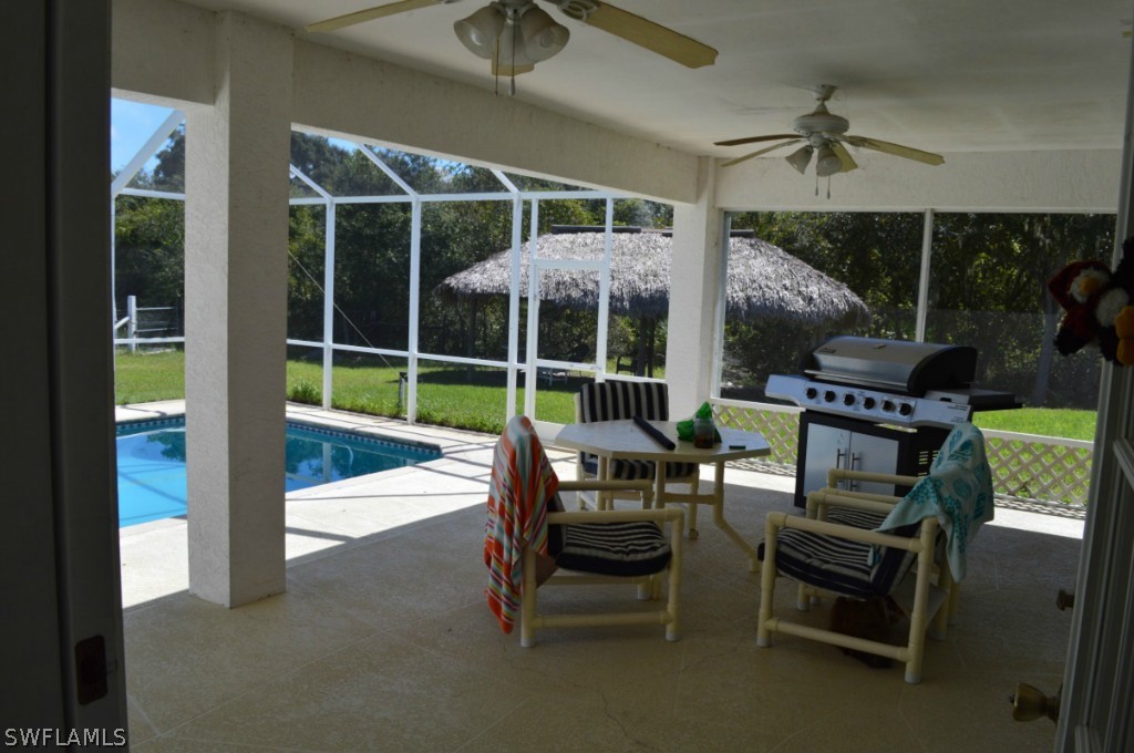 21951 Claytor Road Alva, FL 33920 - Photo 14 of 17 a view of a chairs and table in a patio