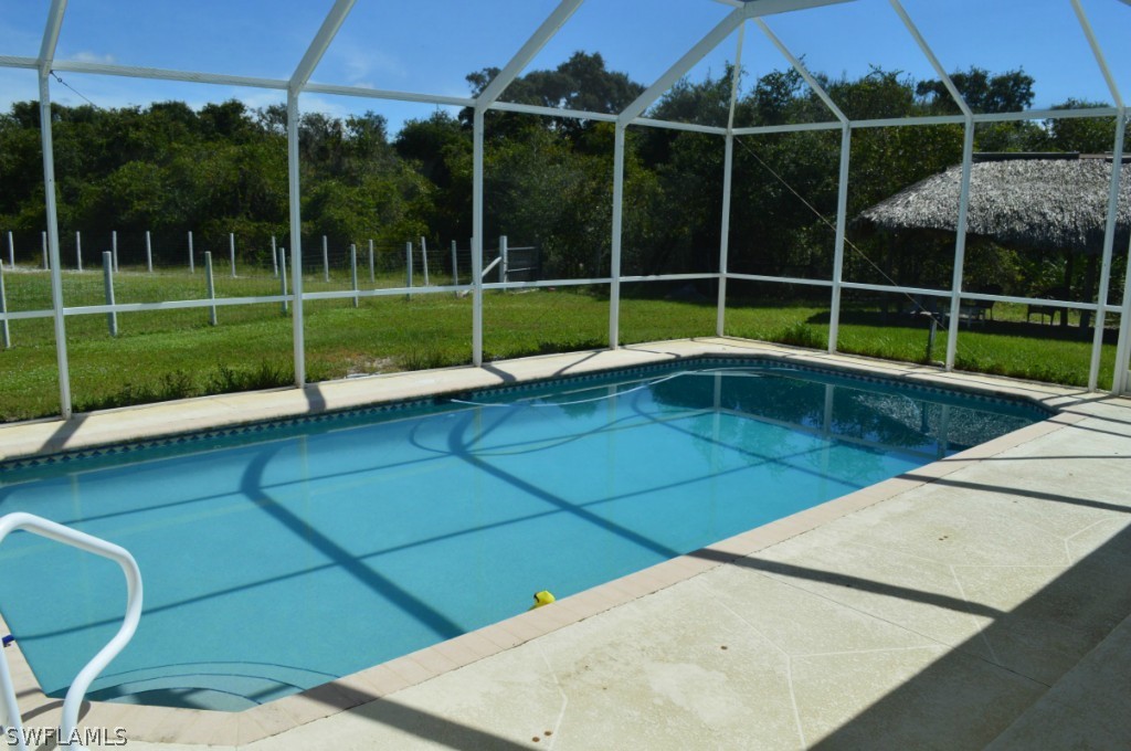 21951 Claytor Road Alva, FL 33920 - Photo 15 of 17 a view of a backyard with swimming pool