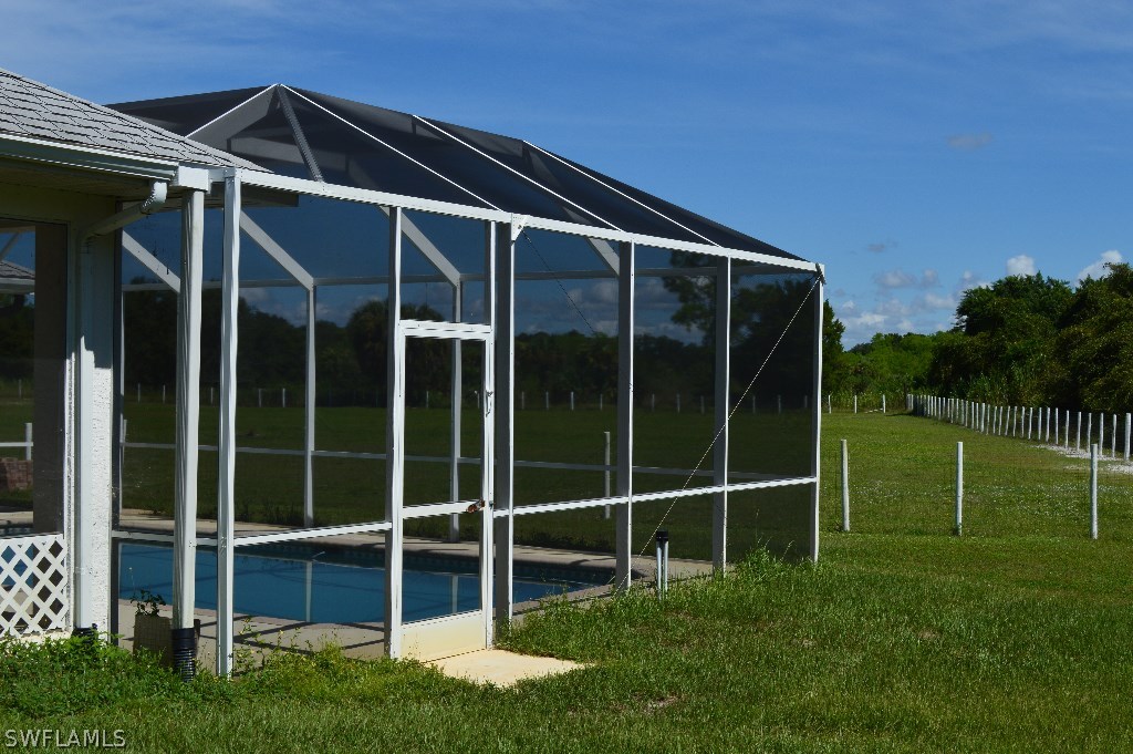 21951 Claytor Road Alva, FL 33920 - Photo 16 of 17 a backyard of a house with lots of green space