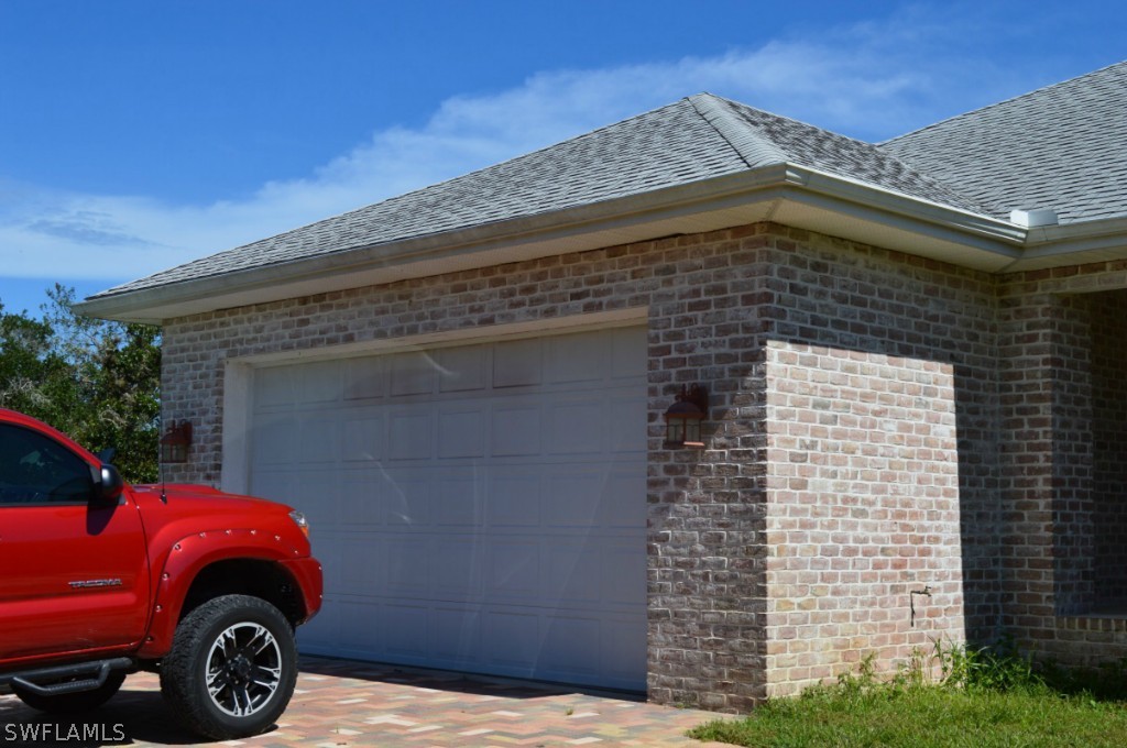 21951 Claytor Road Alva, FL 33920 - Photo 2 of 17 a car parked in front of a house