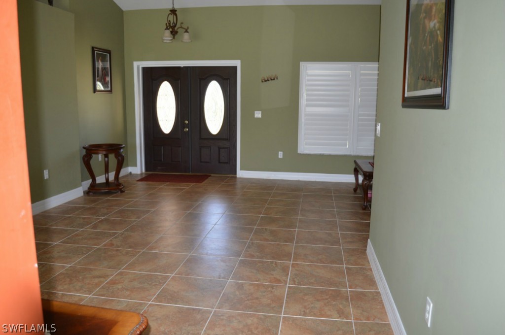21951 Claytor Road Alva, FL 33920 - Photo 7 of 17 a view of a door and chair in a room