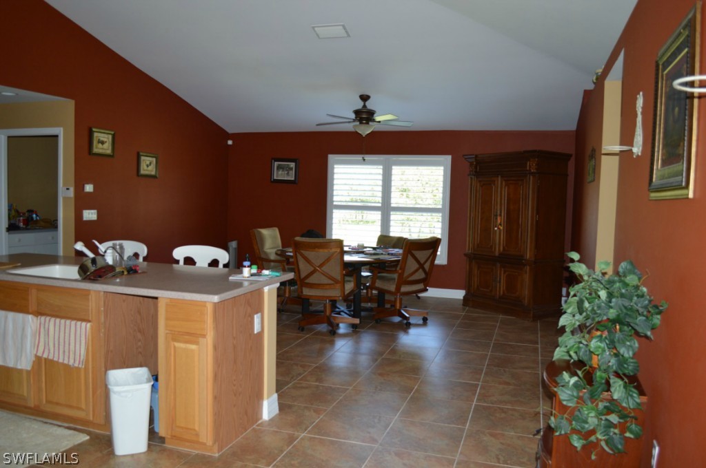 21951 Claytor Road Alva, FL 33920 - Photo 8 of 17 a view of a dining room with furniture and chandelier