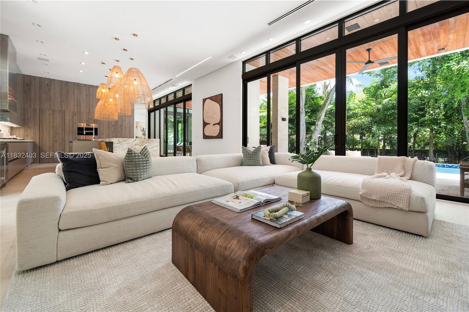 7610 Southwest 48th Court Miami, FL 33143 - Photo 15 of 34 a living room with furniture and a large window
