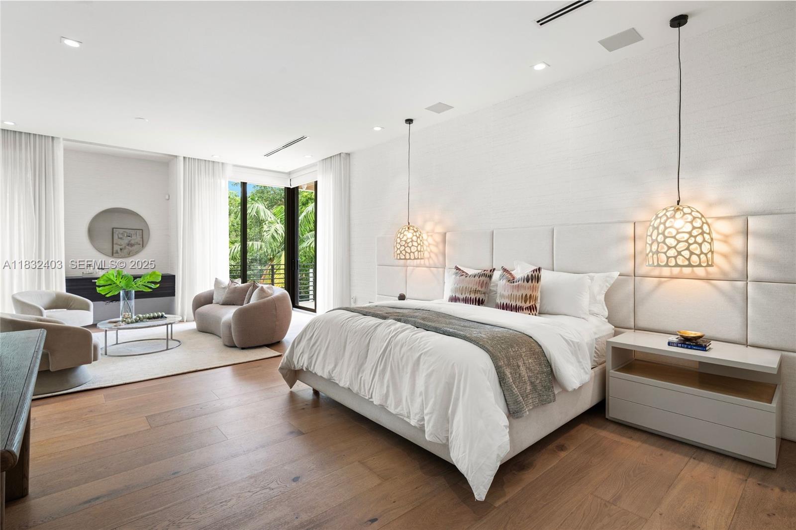 7610 Southwest 48th Court Miami, FL 33143 - Photo 22 of 34 a spacious bedroom with a bed and a couch