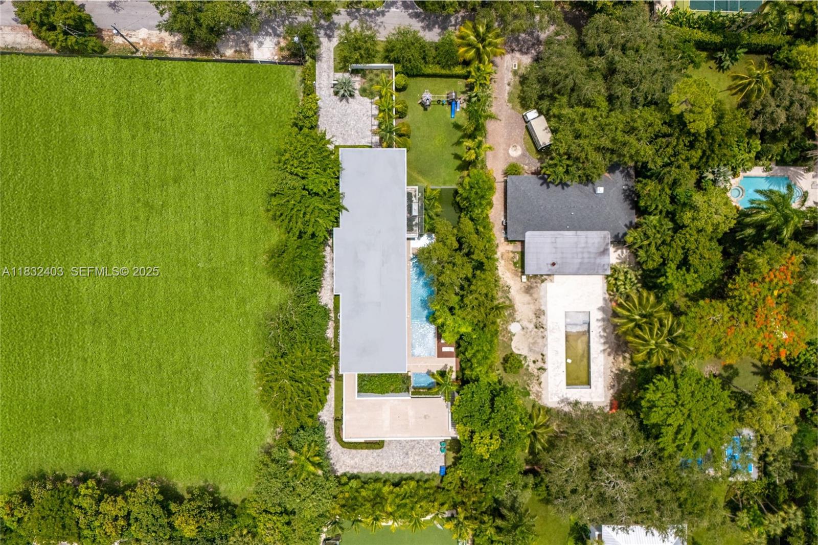 7610 Southwest 48th Court Miami, FL 33143 - Photo 32 of 34 an aerial view of a house with a yard
