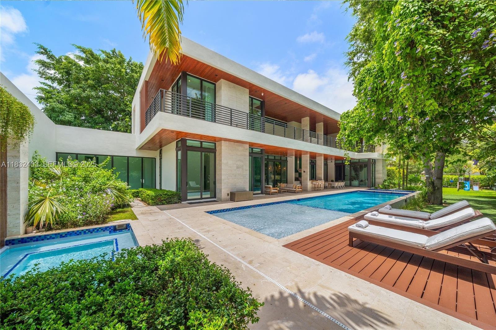 7610 Southwest 48th Court Miami, FL 33143 - Photo 33 of 34 a view of a house with backyard sitting area and garden