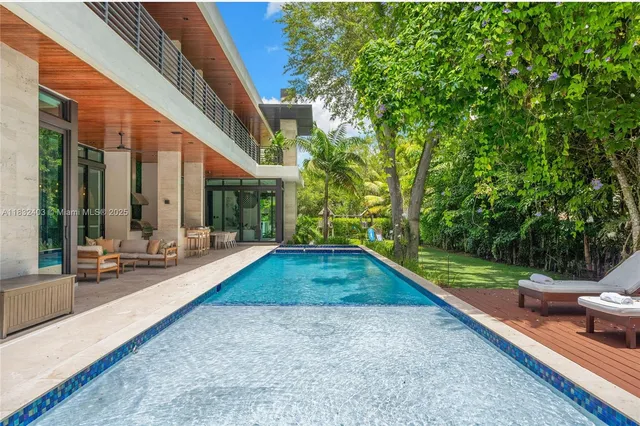 a view of a patio with swimming pool table and chairs