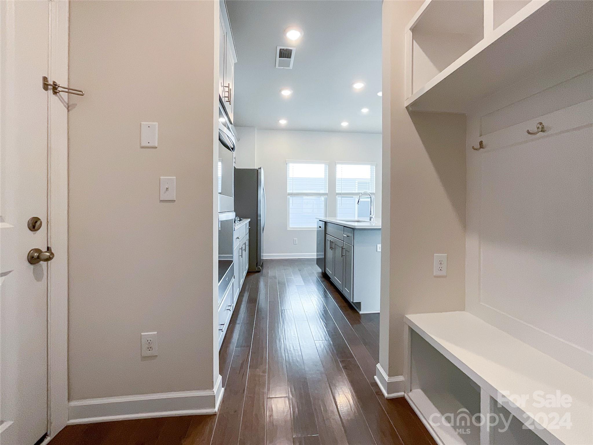 137 Cedar Knoll Circle Pineville, NC 28134 - Photo 17 of 48 a view of a hallway view with wooden floor and staircase