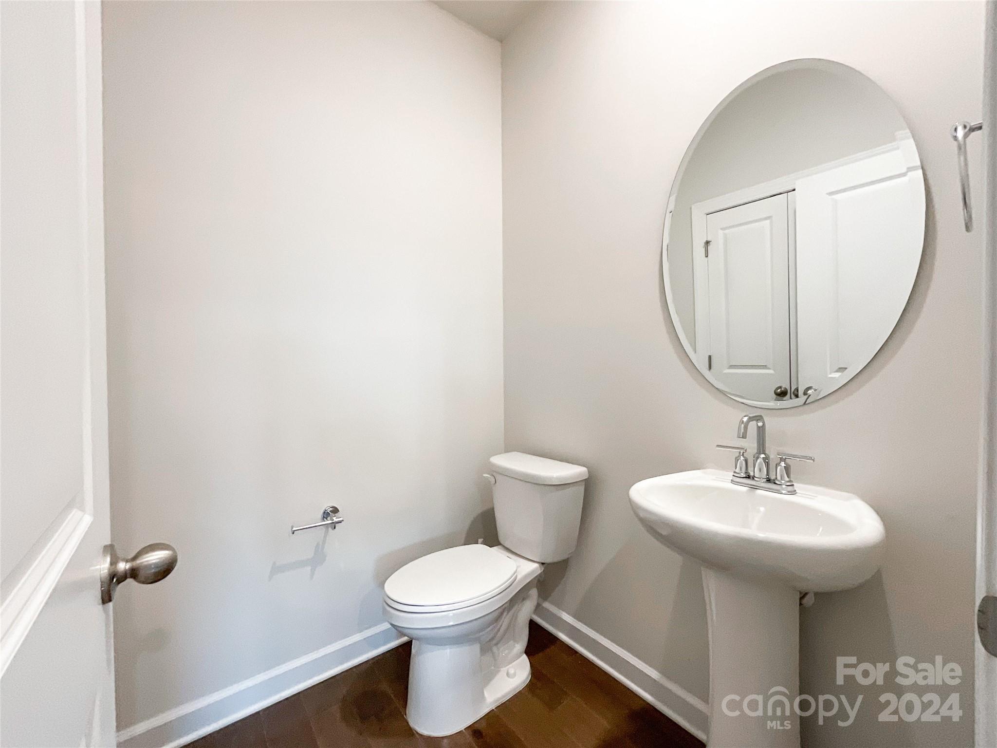 137 Cedar Knoll Circle Pineville, NC 28134 - Photo 18 of 48 a bathroom with a toilet sink and mirror
