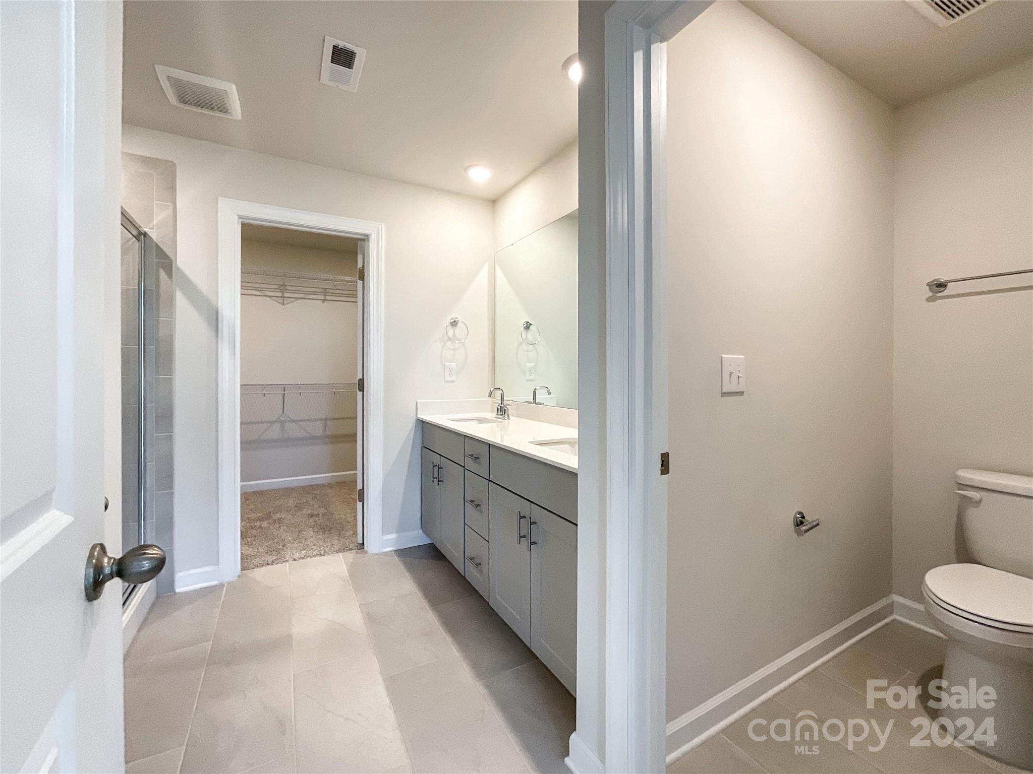 137 Cedar Knoll Circle Pineville, NC 28134 - Photo 27 of 48 a bathroom with a sink a toilet and shower