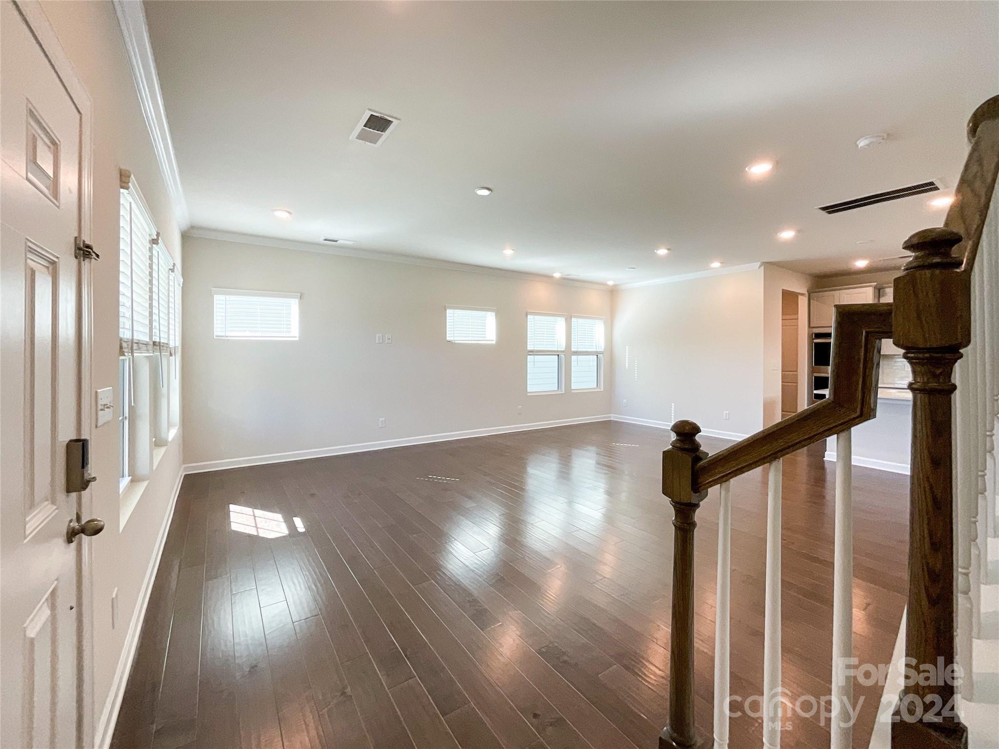 137 Cedar Knoll Circle Pineville, NC 28134 - Photo 3 of 48 a view of empty room with wooden floor and fan