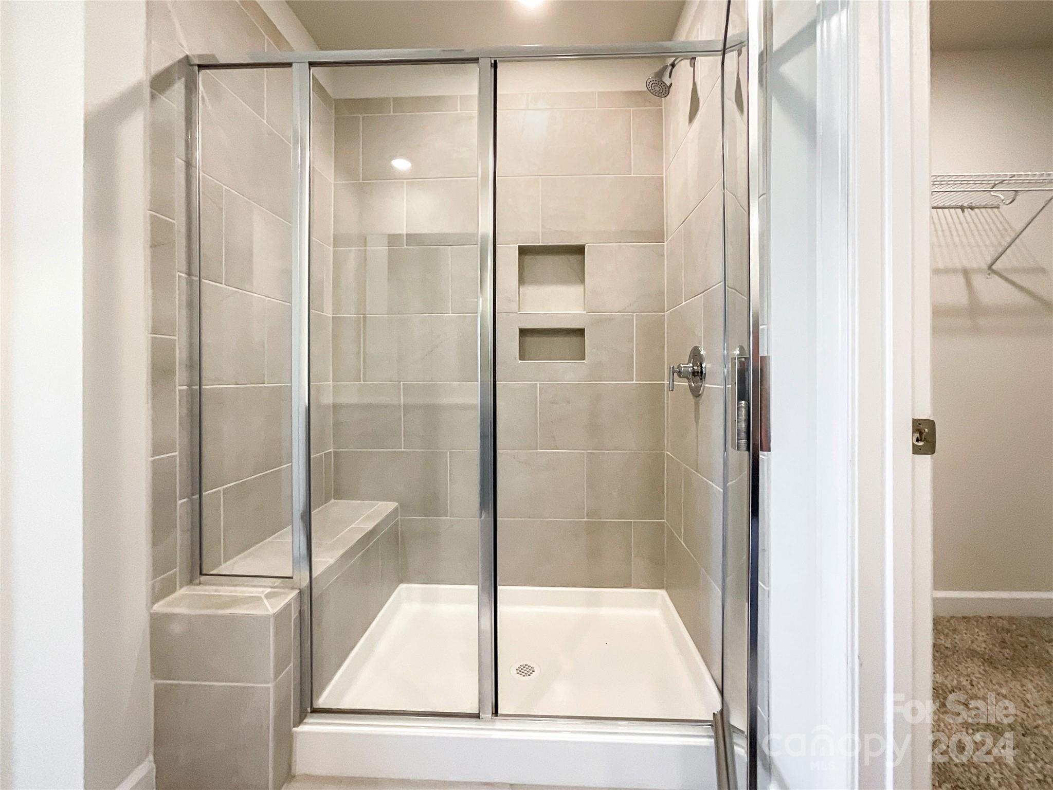 137 Cedar Knoll Circle Pineville, NC 28134 - Photo 31 of 48 a bathroom with a glass shower door