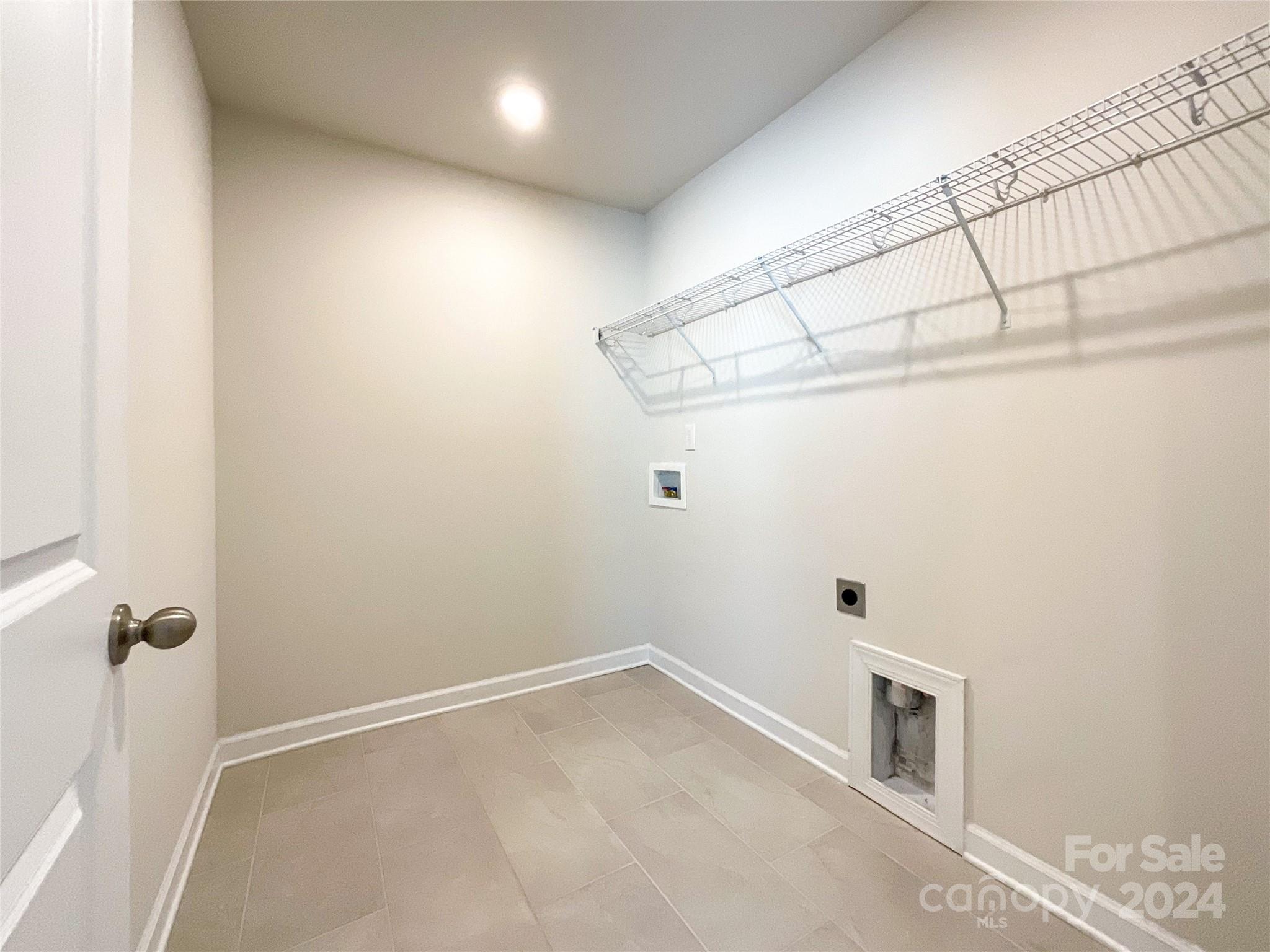 137 Cedar Knoll Circle Pineville, NC 28134 - Photo 34 of 48 a view of a room with racks on the wall