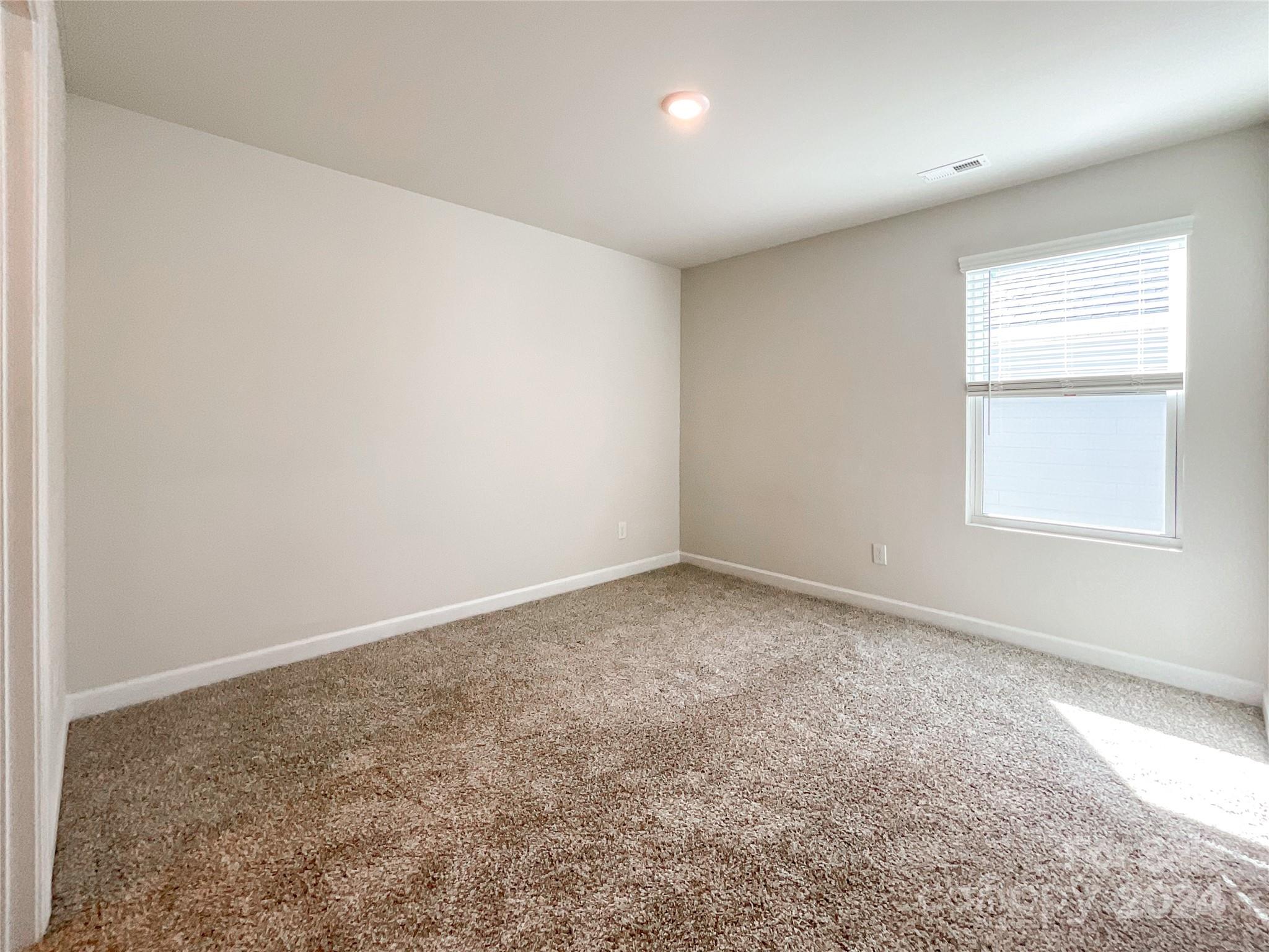 137 Cedar Knoll Circle Pineville, NC 28134 - Photo 35 of 48 an empty room with a window